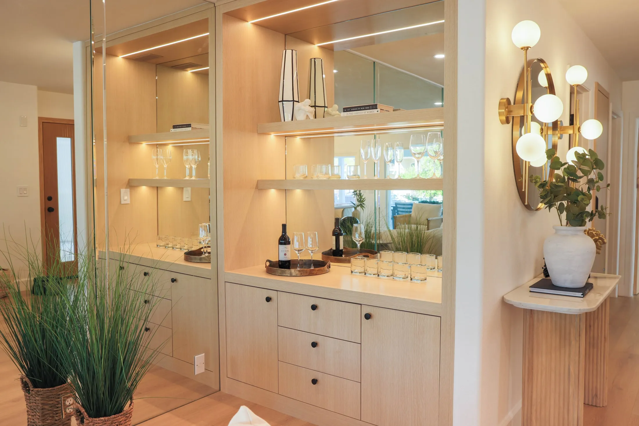 Custom bar shelves and lower cabinets with integrated lighting